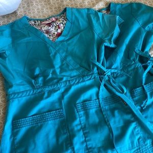 Two turquoise/teal koi scrub top xs used